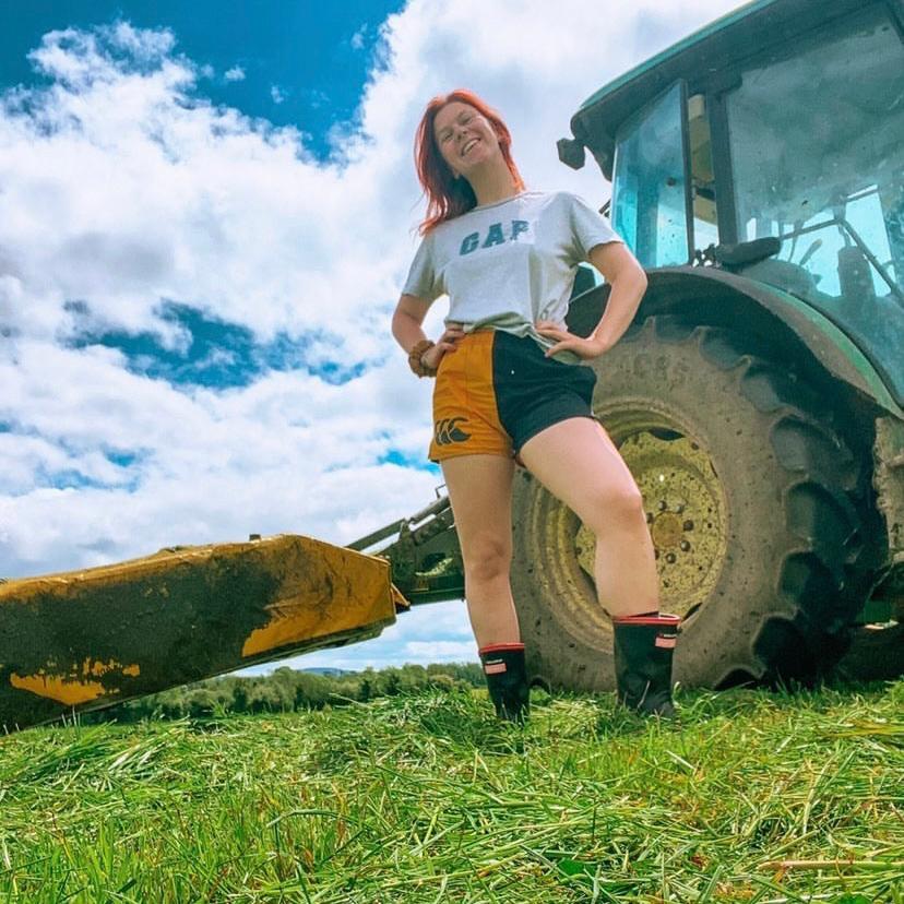 Farm worker wearing gold and black Canterbury shorts