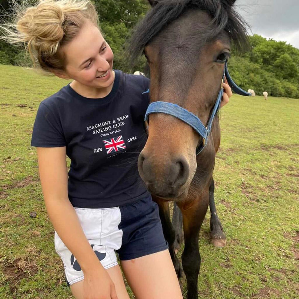 
                  
                    Horse rider wearing white and navy canterbury shorts
                  
                