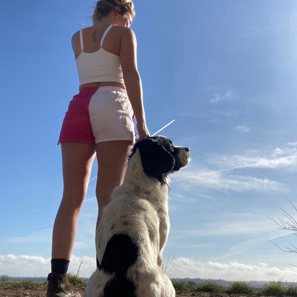 
                  
                    Hiker wearing pink and white Canterbury harlequin shorts and watching the sky
                  
                
