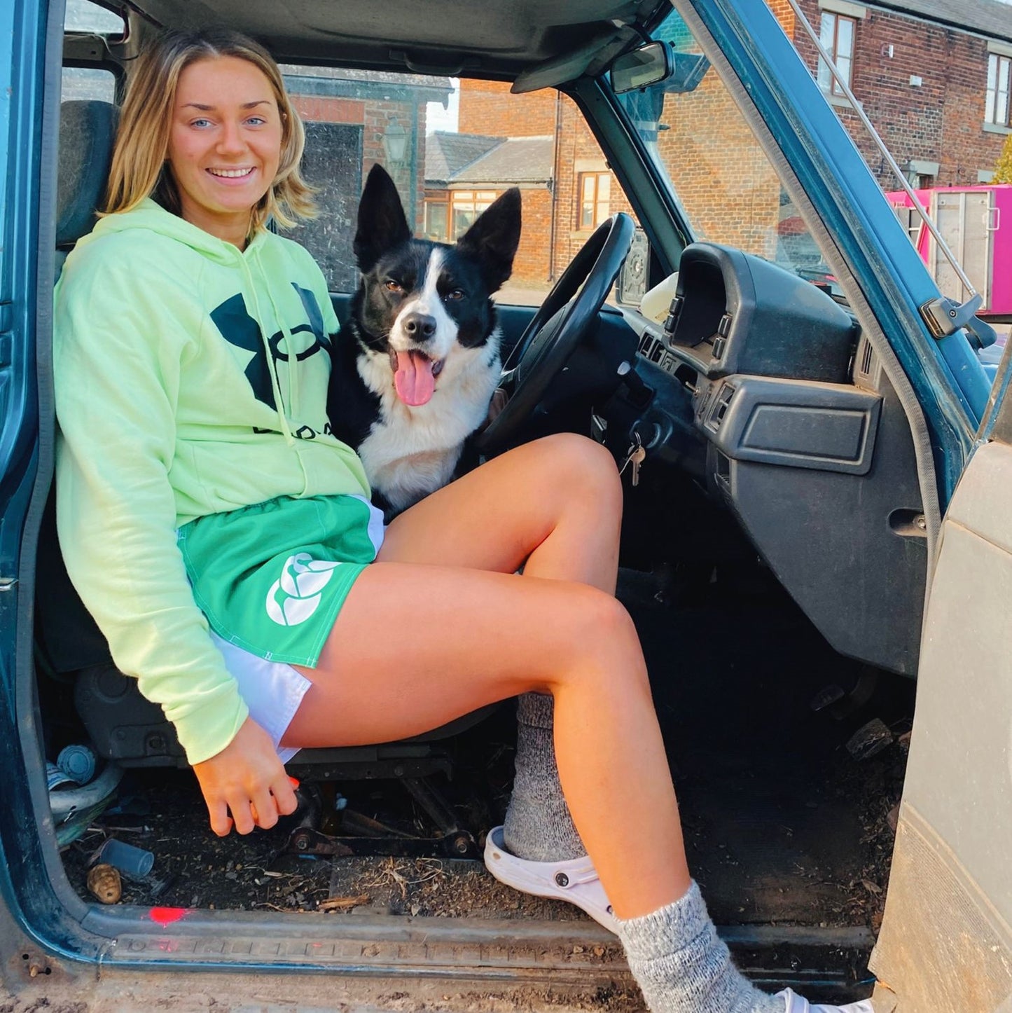 Truck driver wearing green CCC shorts