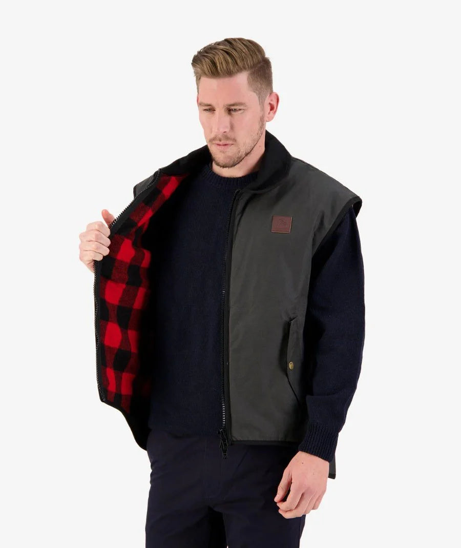 Man showing the wool lining of the farmer vests